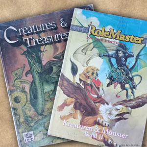 Das Foto zeigt das Creatures & Treasures II und die deutsche Übersetzung Kreaturen & Monster Band II.