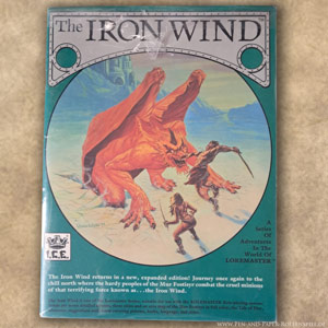 Das Cover von The Iron Wind zeigt einen aus dem Eis aufsteigenden feuerroten Dämon kämpfend gegen zwei barbarisch anmutende Menschen.